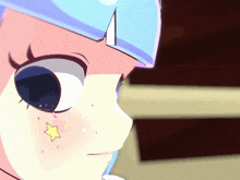 a close up of a girl with a star on her cheek
