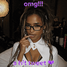 a woman wearing glasses and a white shirt with the words omg !!! a hit tweet below her
