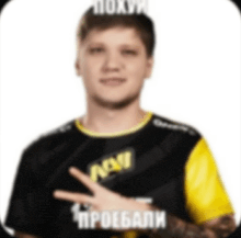 a man wearing a black and yellow shirt with navi written on it