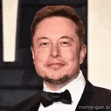 elon musk is wearing a tuxedo and bow tie and smiling for the camera .