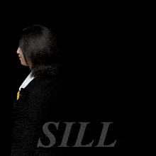a woman is touching another woman 's hair in front of a black background with the letters ll on it