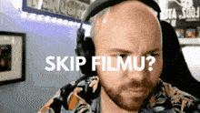 a man wearing headphones says skip filmu on the screen