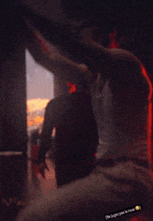 a man is doing a handstand in front of a large screen that says " ne joue pas la roue "