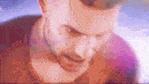 a close up of a man 's face with a beard