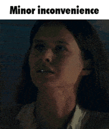 a woman is crying with the words minor inconvenience written above her