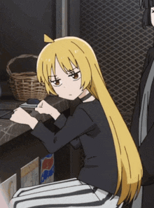 a girl with long blonde hair is sitting at a counter