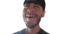 a man with a beard is laughing with his eyes closed and his mouth open
