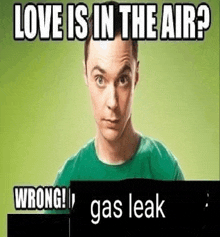 a man in a green shirt is holding a sign that says `` love is in the air ? wrong ! ''