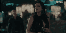 a man and a woman are in a blurry photo with netflix written on the bottom