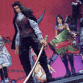 a man with a sword is standing in front of a group of people