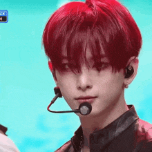a close up of a person with red hair and a microphone
