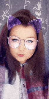 a girl wearing glasses with purple cat ears