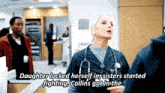 a woman with a stethoscope around her neck is talking to a man in a hospital room .