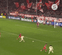 a soccer game is being played in front of a banner for pepsi and heineken