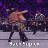 two men are wrestling in a wrestling ring with the words `` back suplex '' written on the bottom .