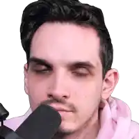 a man with his eyes closed is wearing a pink hoodie and a black microphone