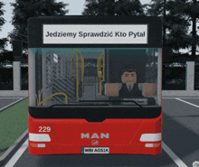 a red man bus with the number 229 on it