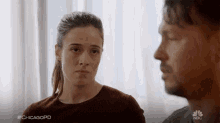 a man and a woman are looking at each other with #chicagopd