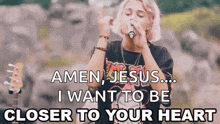 a woman singing into a microphone with the words `` amen jesus ... i want to be closer to your heart ''