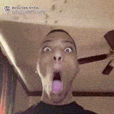 a man is sticking his tongue out in front of a ceiling fan and the word amateurism is on the bottom right