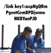 two men are looking at a laptop with the words / link key1 : aspngqrm pgvntcembpdjwmw
