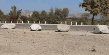 a row of rocks on the side of the road