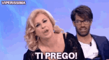 a man and a woman are on a television show and the woman is saying ti prego