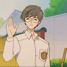 a man wearing glasses and a white shirt with a cross on the pocket