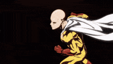 a man in a cape is walking in the dark