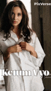 a woman in a white shirt with the name ketum vyo on it