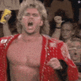 a man in a red jacket is screaming in a crowd