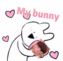 a white bunny holding a picture of a man and the words " my bunny "