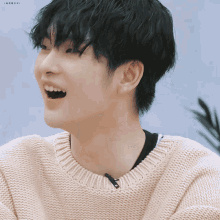 a close up of a person wearing a sweater with a zipper on the neck