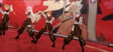 a group of anime characters are dancing on a stage in front of a wall with hearts on it