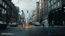 a blurred image of a city street with #theflashmovie written in the corner