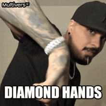 a man wearing a hat and a diamond bracelet is holding another man 's arm with the caption diamond hands