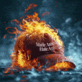 a burning hat that says made america hate again on it