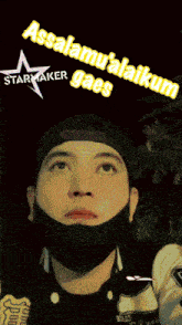 a man wearing a mask and a starmaker hat looks up at the sky