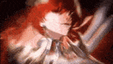 a close up of a person with red hair .