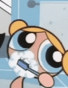 bubbles from the powerpuff girls is brushing her teeth with a blue toothbrush