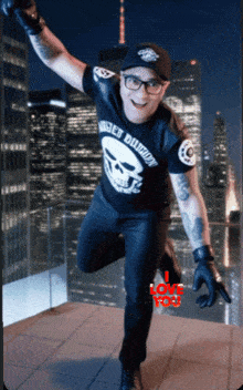 a man wearing a shirt that says biker daddy is jumping in the air