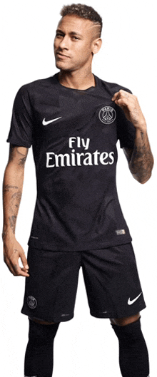 a man wearing a black fly emirates jersey