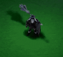 a person is kneeling down on the grass holding a sword in a video game .