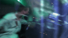 a blurry photo of a man holding a microphone