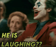a man in a clown costume is laughing with the words " he is laughing " above him