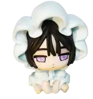 a doll with purple eyes is wearing a white blanket