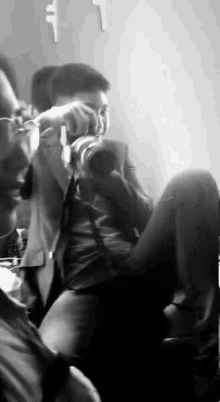 a man is taking a picture with a camera