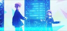 a boy and a girl are dancing on a stage in front of a screen .