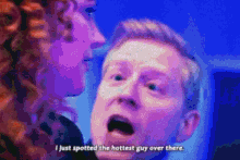 a man and a woman are looking at each other and the woman says i just spotted the hottest guy over there