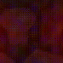a close up of a red and black polka dot pattern on a red background .